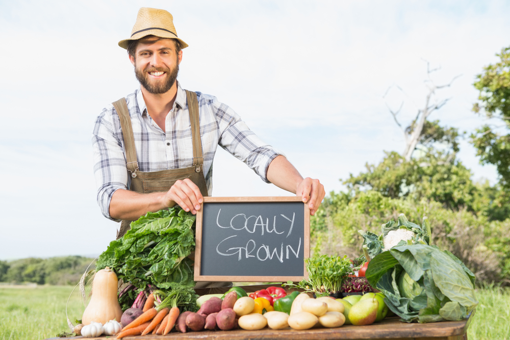 Farmer selling his organic produce on a sunny day